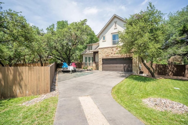 11612 Sierra Nevada, Austin, TX 78759 - view of front of house with stone siding, driveway, an attached garage, and stucco siding