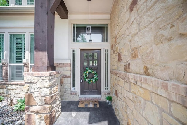 11612 Sierra Nevada, Austin, TX 78759 - view of exterior entry featuring stone siding
