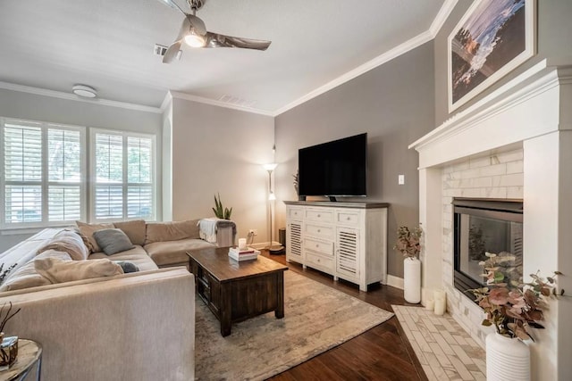 11612 Sierra Nevada, Austin, TX 78759 - living area featuring a ceiling fan, crown molding, wood finished floors, and a fireplace