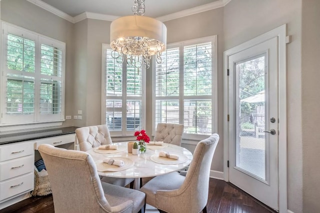11612 Sierra Nevada, Austin, TX 78759 - dining area with healthy amount of natural light, a chandelier, dark wood-type flooring, and ornamental molding