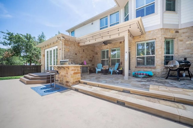 11612 Sierra Nevada, Austin, TX 78759 - view of patio with an outdoor kitchen and ceiling fan