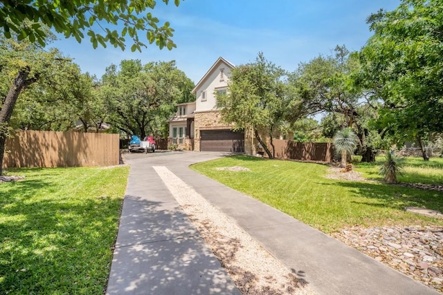 11612 Sierra Nevada, Austin, TX 78759 - view of front facade with stone siding, a garage, driveway, and stucco siding