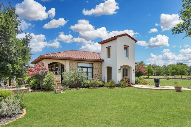 601 Strada Luca, Florence, TX 76527 - view of front of property featuring a tiled roof, stucco siding, and a front lawn