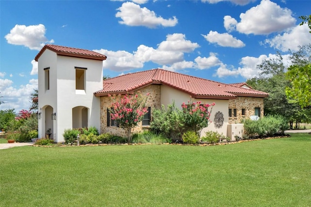 601 Strada Luca, Florence, TX 76527 - mediterranean / spanish-style house with stucco siding, a tiled roof, and a front yard