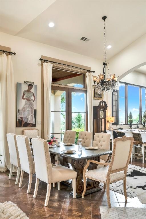 601 Strada Luca, Florence, TX 76527 - dining area with a chandelier, healthy amount of natural light, french doors, recessed lighting, and arched walkways