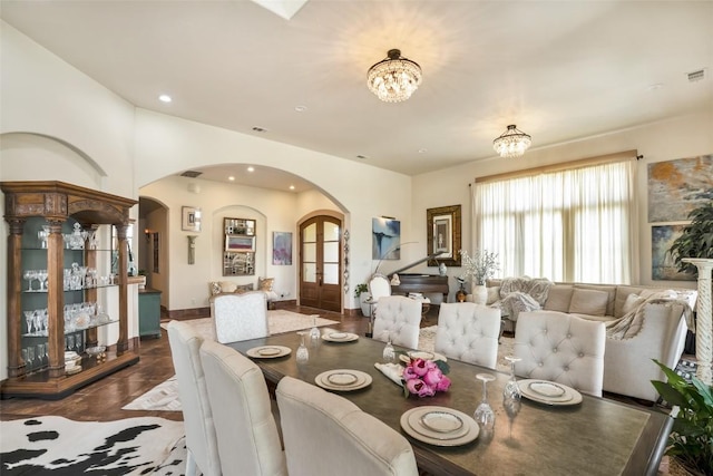 601 Strada Luca, Florence, TX 76527 - dining room featuring arched walkways, a chandelier, recessed lighting, and french doors
