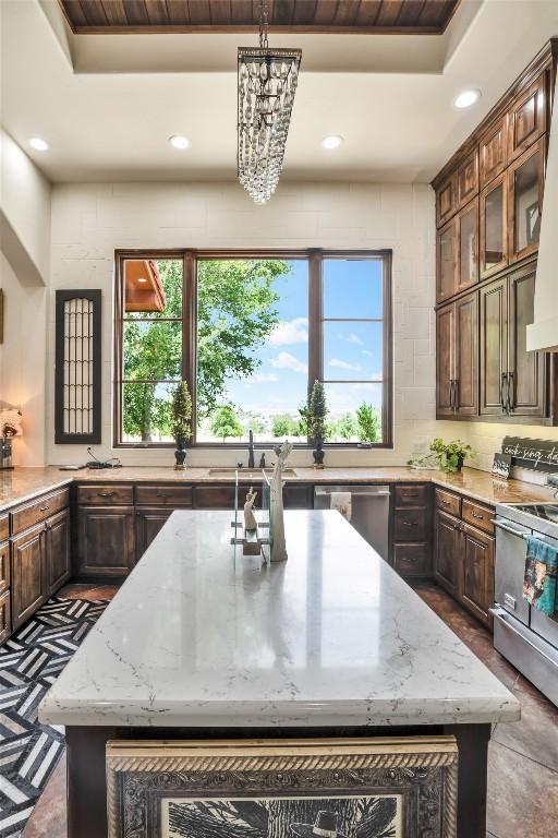 601 Strada Luca, Florence, TX 76527 - kitchen featuring a kitchen island, stainless steel appliances, recessed lighting, plenty of natural light, and a chandelier