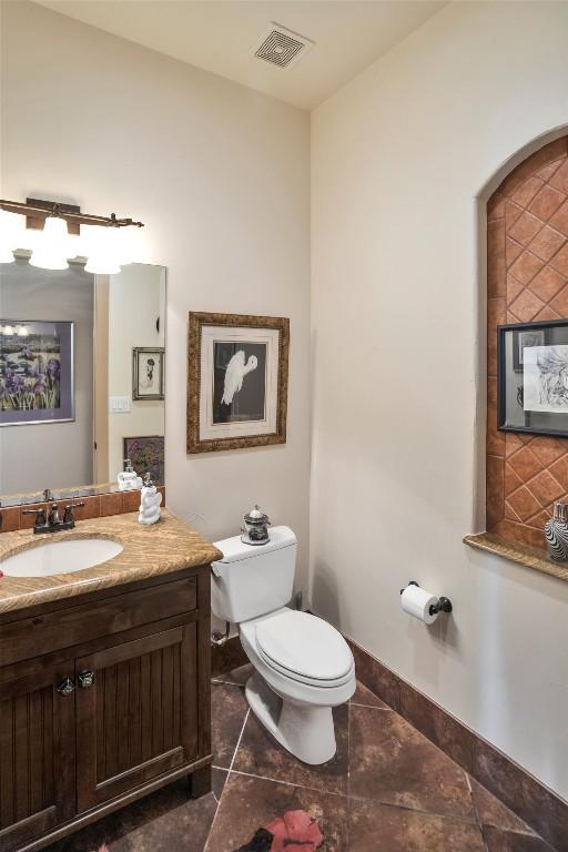 601 Strada Luca, Florence, TX 76527 - half bathroom with vanity and tile patterned flooring