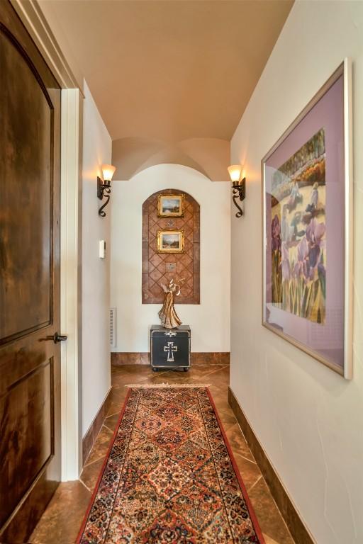 601 Strada Luca, Florence, TX 76527 - hallway with arched walkways and baseboards