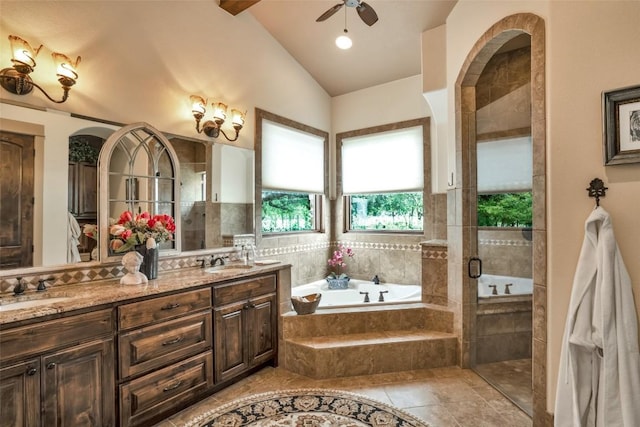 601 Strada Luca, Florence, TX 76527 - bathroom featuring a bath, double vanity, a shower stall, a ceiling fan, and tile patterned flooring