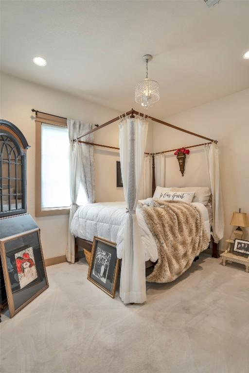 601 Strada Luca, Florence, TX 76527 - bedroom featuring carpet flooring, a chandelier, and recessed lighting