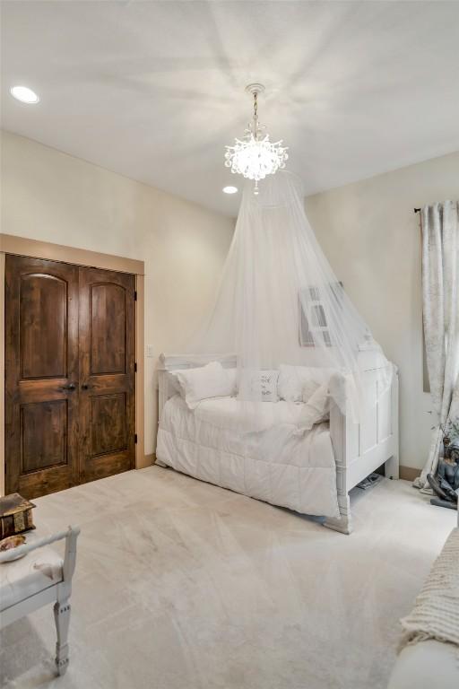 601 Strada Luca, Florence, TX 76527 - bedroom with a chandelier and carpet flooring
