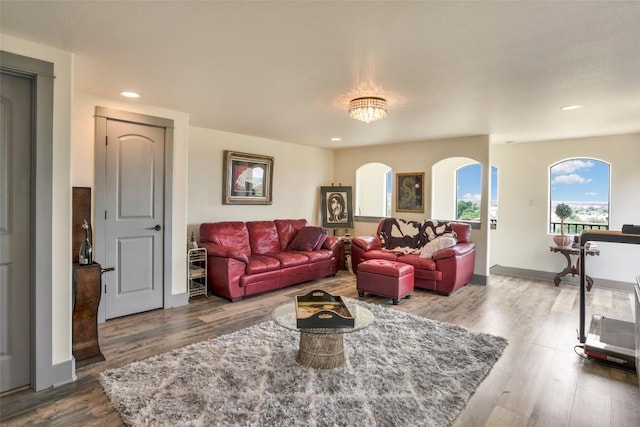 601 Strada Luca, Florence, TX 76527 - living room with wood finished floors, recessed lighting, and arched walkways