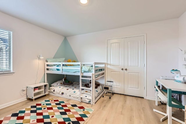 236 Cinnamon Loop, Burnet, TX 78611 - bedroom featuring wood finished floors and a closet
