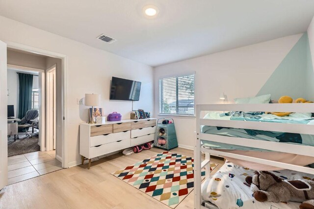 236 Cinnamon Loop, Burnet, TX 78611 - bedroom featuring light wood-style floors and baseboards