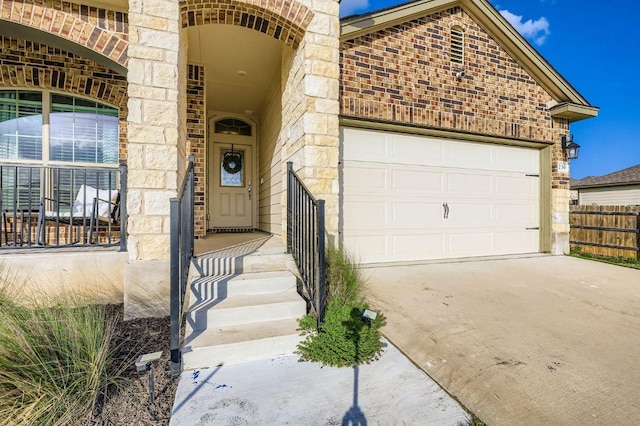 236 Cinnamon Loop, Burnet, TX 78611 - view of front of property featuring brick siding, driveway, a garage, and stone siding