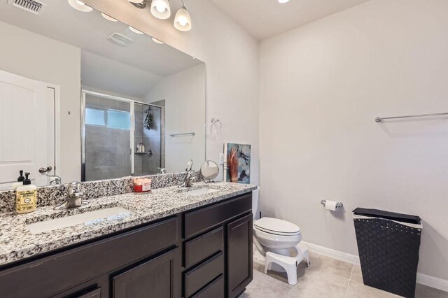 236 Cinnamon Loop, Burnet, TX 78611 - bathroom with a stall shower, double vanity, lofted ceiling, and tile patterned flooring
