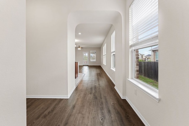 633 Weizenbock Ln, Austin, TX 78728 - hallway with dark wood-style floors and arched walkways