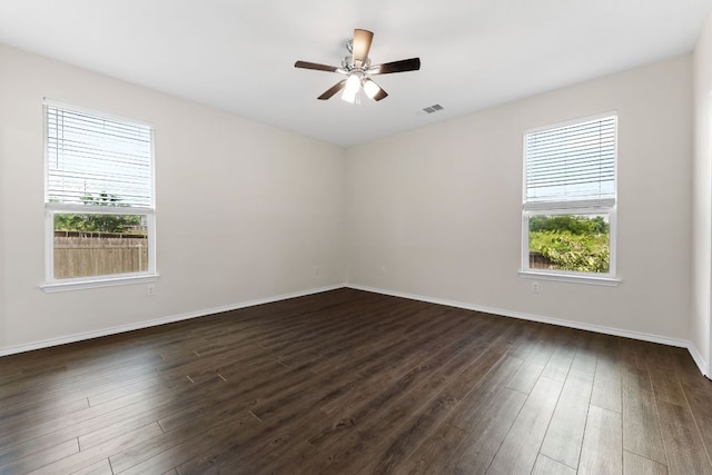 633 Weizenbock Ln, Austin, TX 78728 - empty room with dark wood-style floors and ceiling fan