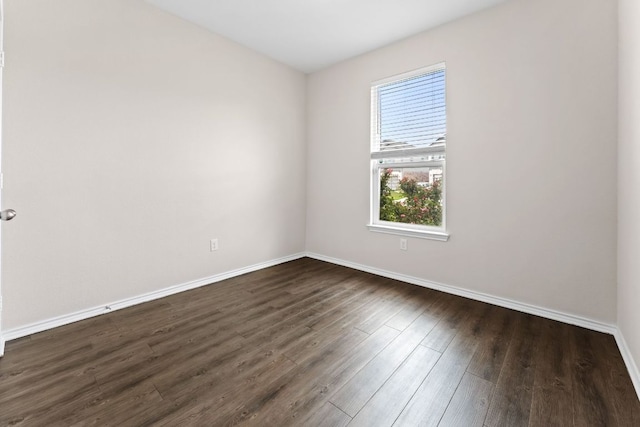 633 Weizenbock Ln, Austin, TX 78728 - empty room with baseboards and dark wood-type flooring