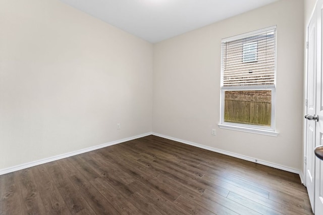 633 Weizenbock Ln, Austin, TX 78728 - empty room with dark wood-style flooring and baseboards