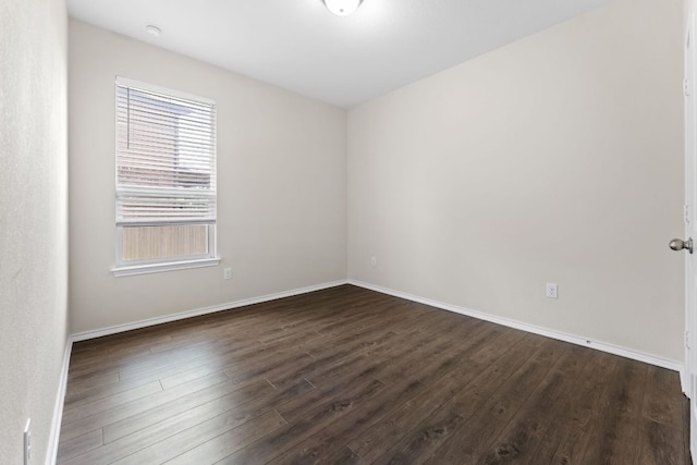 633 Weizenbock Ln, Austin, TX 78728 - spare room featuring dark wood-type flooring and baseboards