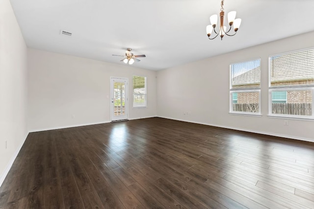 633 Weizenbock Ln, Austin, TX 78728 - spare room with a chandelier, ceiling fan, and dark wood-style floors