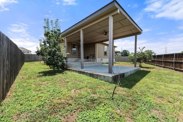 633 Weizenbock Ln, Austin, TX 78728 - fenced backyard featuring a patio and ceiling fan