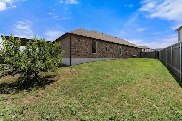 633 Weizenbock Ln, Austin, TX 78728 - back of house with a fenced backyard and brick siding