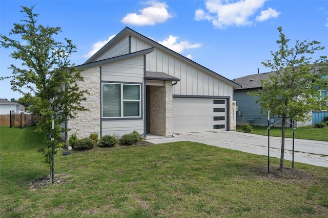 13821 Zuhause Dr, Pflugerville, TX 78660 - view of front of home with board and batten siding, stone siding, an attached garage, and driveway