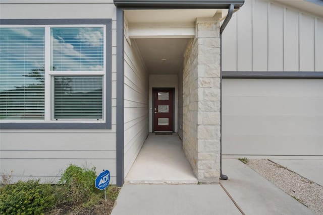 13821 Zuhause Dr, Pflugerville, TX 78660 - doorway to property featuring stone siding