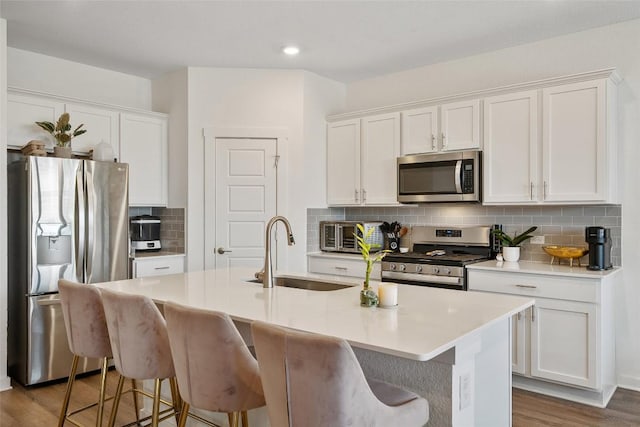 13821 Zuhause Dr, Pflugerville, TX 78660 - kitchen with stainless steel appliances, decorative backsplash, white cabinetry, and recessed lighting