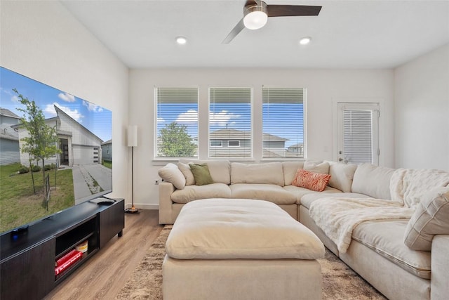 13821 Zuhause Dr, Pflugerville, TX 78660 - living room featuring light wood-type flooring, plenty of natural light, ceiling fan, and recessed lighting