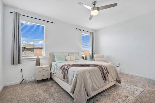 13821 Zuhause Dr, Pflugerville, TX 78660 - carpeted bedroom featuring baseboards and a ceiling fan