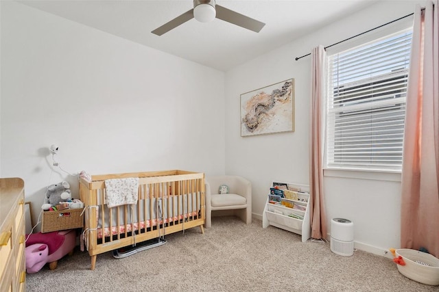 13821 Zuhause Dr, Pflugerville, TX 78660 - bedroom featuring a nursery area, carpet, and ceiling fan