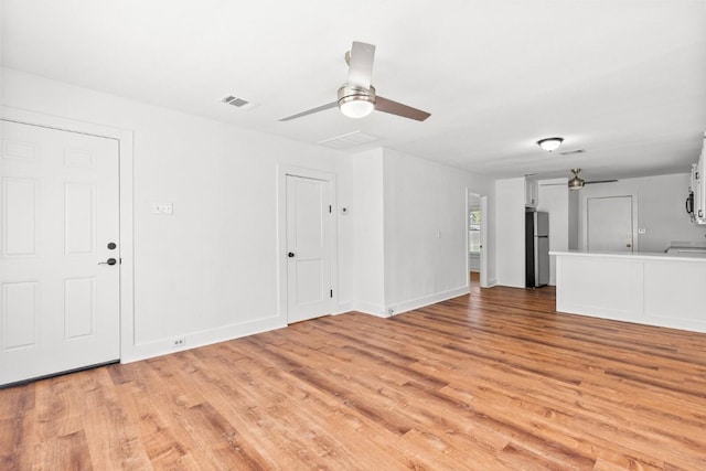 1020 S 23rd St, Temple, TX 76504 - unfurnished living room featuring a ceiling fan and light wood finished floors