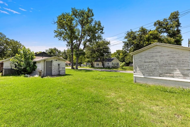 1020 S 23rd St, Temple, TX 76504 - view of grassy yard featuring a storage shed