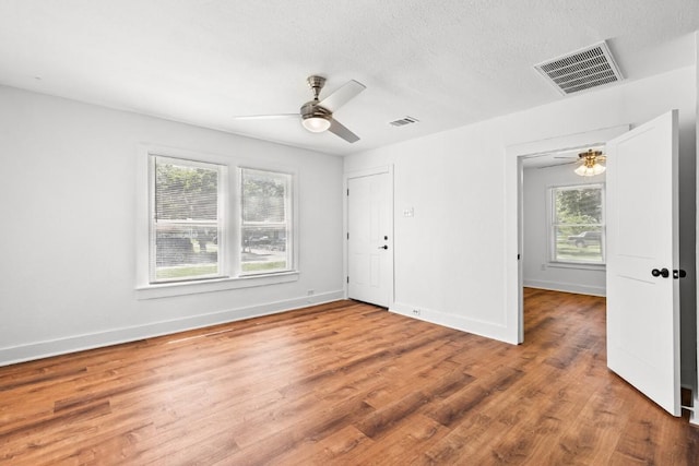 1020 S 23rd St, Temple, TX 76504 - unfurnished bedroom with wood finished floors and ceiling fan