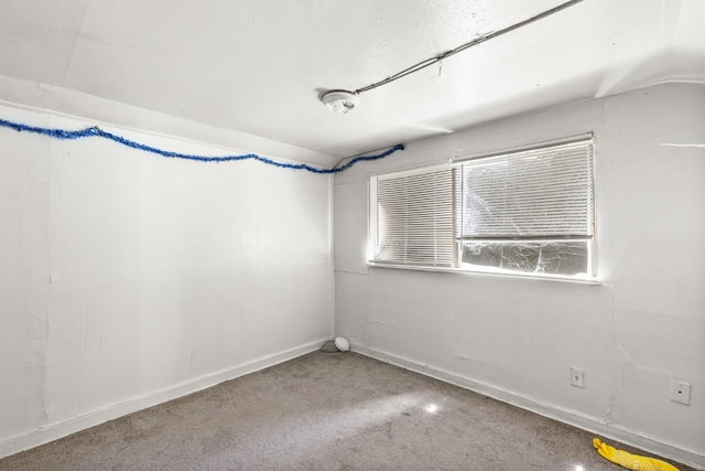 1020 S 23rd St, Temple, TX 76504 - spare room with vaulted ceiling and carpet floors