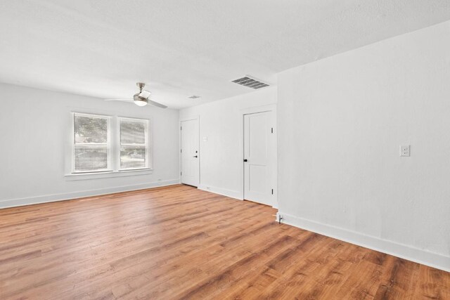 1020 S 23rd St, Temple, TX 76504 - spare room with light wood-style floors and a ceiling fan