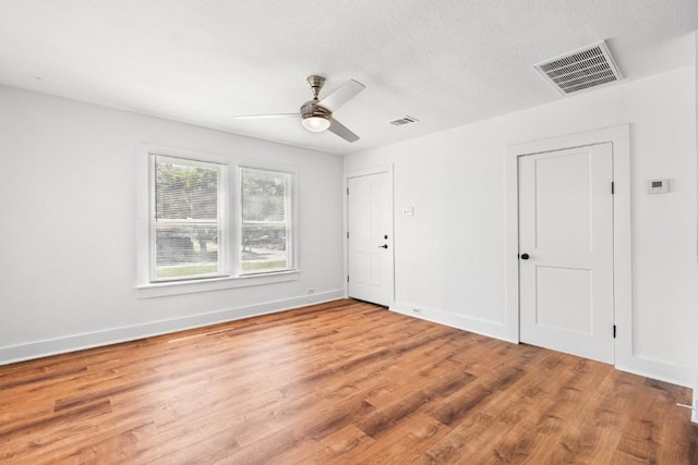 1020 S 23rd St, Temple, TX 76504 - unfurnished bedroom featuring wood finished floors and ceiling fan