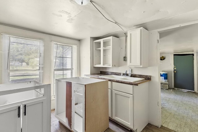 1020 S 23rd St, Temple, TX 76504 - kitchen with white cabinetry and open shelves