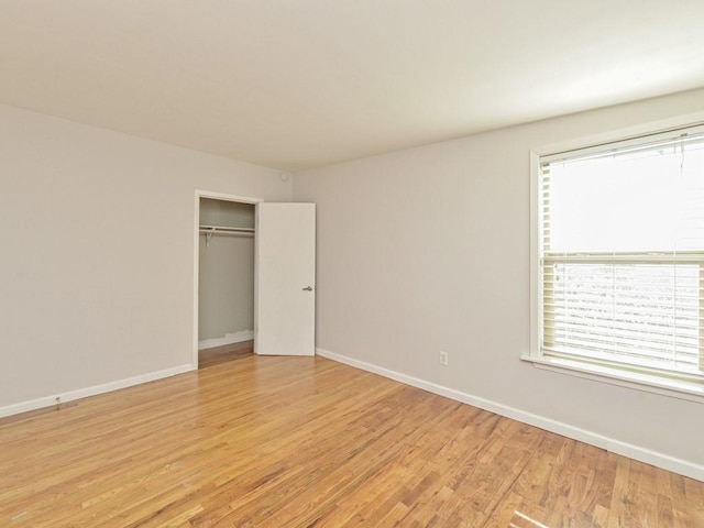 4408 Mount Vernon Dr, Austin, TX 78745 - unfurnished bedroom with multiple windows, light wood-style floors, and a closet