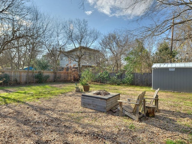 4408 Mount Vernon Dr, Austin, TX 78745 - fenced backyard with an outdoor fire pit and a storage shed