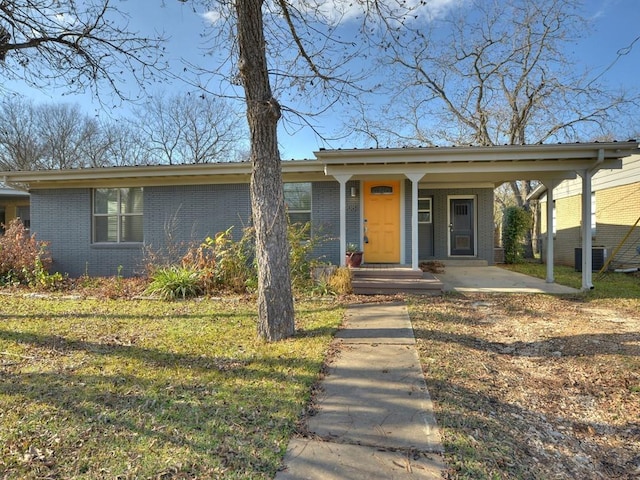 4408 Mount Vernon Dr, Austin, TX 78745 - ranch-style home with brick siding, covered porch, an attached carport, and a front yard