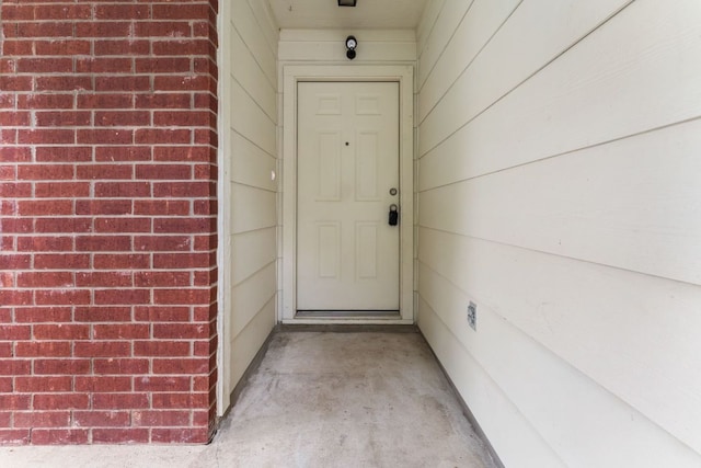 184 Atlantis, Kyle, TX 78640 - doorway to property with brick siding
