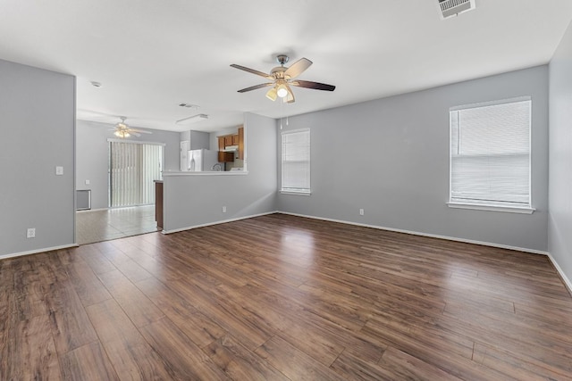 184 Atlantis, Kyle, TX 78640 - unfurnished living room with a ceiling fan and dark wood finished floors