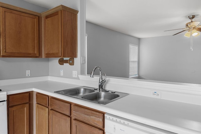 184 Atlantis, Kyle, TX 78640 - kitchen with ceiling fan, light countertops, brown cabinets, and white dishwasher