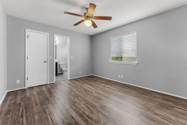 184 Atlantis, Kyle, TX 78640 - unfurnished bedroom with wood finished floors, ensuite bathroom, and a ceiling fan
