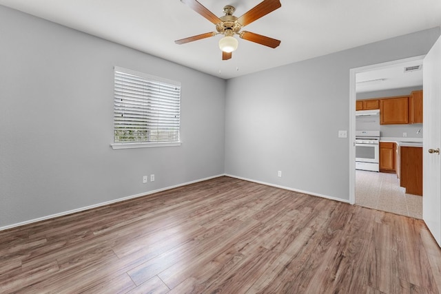 184 Atlantis, Kyle, TX 78640 - empty room with light wood-style flooring and ceiling fan
